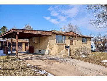 Charming one-story brick home featuring a covered carport and well-maintained front yard at 4133 S Kalamath Ct, Englewood, CO 80110