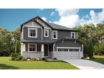 Charming two-story home with gray siding, stone accents, a covered porch, and a two-car garage at 1391 Lumber Ridge N Cir, Erie, CO 80516