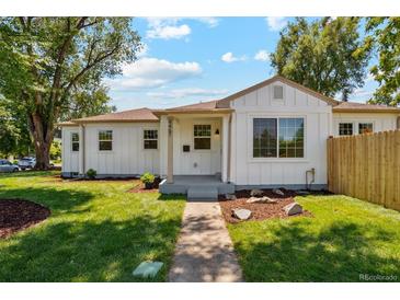 Charming home with a well-manicured lawn and inviting walkway, showing great curb appeal at 4467 N Umatilla St, Denver, CO 80211