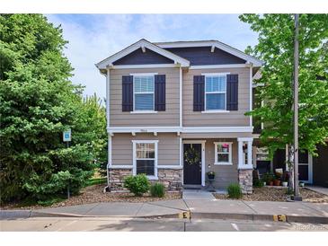 Charming two-story home with a welcoming front porch, lovely landscaping and stone accents at 9066 Apache Plume Dr # E, Parker, CO 80134