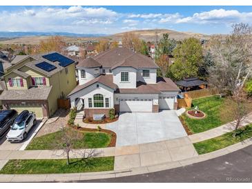 Beautiful two-story home with a three-car garage, manicured lawn, and mountain views in a desirable neighborhood at 2359 Dogwood Dr, Erie, CO 80516