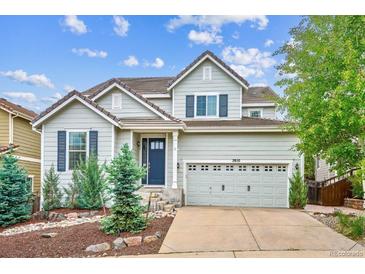 Charming two-story home featuring well-maintained landscaping and an attached two-car garage at 2810 Shadow Dance Dr, Castle Rock, CO 80109