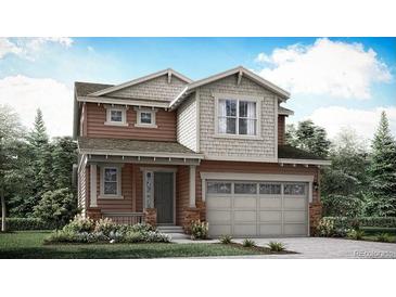 Charming two-story home with a two-car garage, stylish architecture, and manicured landscaping at 7357 S Yank Ct, Littleton, CO 80127