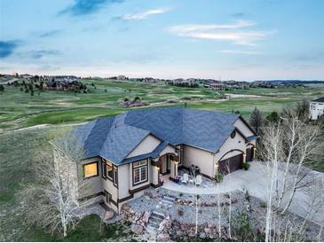 Stunning aerial view of the home overlooking the golf course, offering serene surroundings at 1236 Castlecombe Ln, Monument, CO 80132