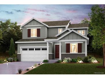 Charming two-story home with landscaped yard and attached two car garage at 14139 Bunny Hop Ln, Parker, CO 80134