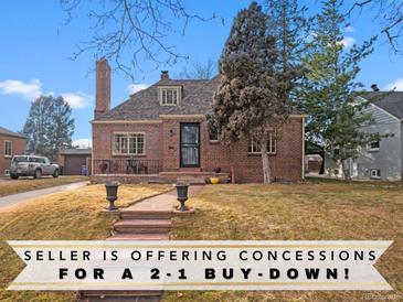 Charming brick home featuring a landscaped front yard, stone steps, and a welcoming entrance at 1545 Locust St, Denver, CO 80220