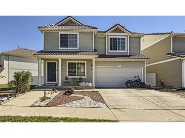 Charming two-story home with a well-maintained front yard and a two-car garage. Perfect for families! at 20530 Randolph Pl, Denver, CO 80249