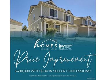 Exterior home shot shows the front of the home, lawn and roof with a price reduction notice at 20530 Randolph Pl, Denver, CO 80249