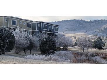 Beautiful condo exterior showcasing the neighborhood and the frosted winter landscape at 911 Laramie Blvd # B, Boulder, CO 80304