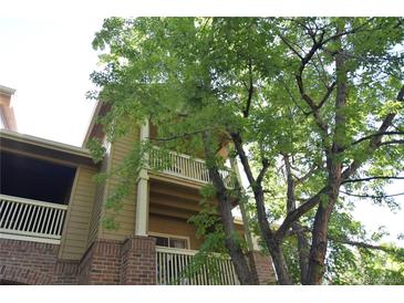 Charming condo featuring double balconies with brick and siding exterior accents at 1631 W Canal Cir # 832, Littleton, CO 80120