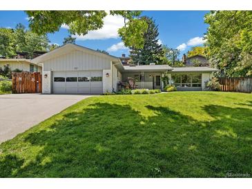 Charming single-story home featuring a well-manicured lawn, classic design, and a welcoming front entrance at 937 S Cole Dr, Lakewood, CO 80228