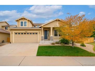Charming single-Gathering home featuring a two-car garage and well-maintained lawn at 4850 Bluegate Ln, Highlands Ranch, CO 80130