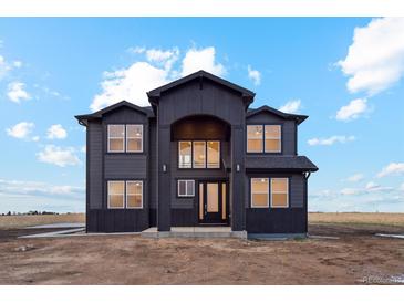 Beautiful two-story home with black siding and a modern architectural design on a spacious lot at 49601 E 56Th Ave, Bennett, CO 80102