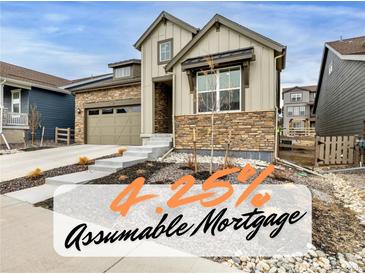 Charming two-story home featuring stone accents and a well-maintained front yard at 8175 Sewanee Peak St, Littleton, CO 80125