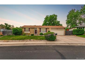 Charming ranch-style home features well-maintained landscaping and attached two-car garage at 3780 E 117Th Ave, Thornton, CO 80233