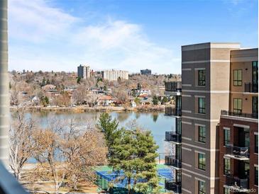 Serene building view overlooking a calm lake and cityscape, complete with distant buildings and clear blue skies at 4200 W 17Th Ave # 621, Denver, CO 80204