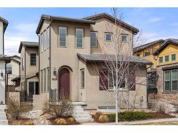 Charming two-story home featuring a landscaped front yard, a covered entry, and an inviting facade at 15525 W La Salle Ave, Lakewood, CO 80228