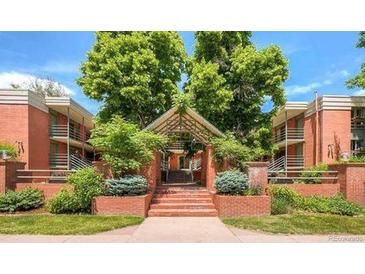 A beautiful brick condo complex with lush landscaping and mature trees in a desirable location at 625 Pearl St # 23, Boulder, CO 80302