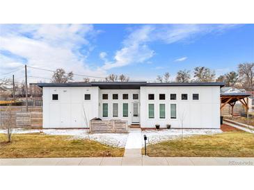 Striking modern home featuring a flat roof, light exterior, and contemporary design at 2650 W Asbury Ave, Denver, CO 80219