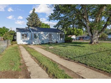 Charming single-story home with mature trees, a ramp, and a concrete driveway at 2105 S Irving St, Denver, CO 80219