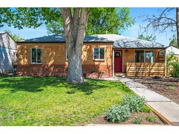 Charming brick home with a red door, lush lawn and mature tree offering a welcoming curb appeal at 4456 S Washington St, Englewood, CO 80113