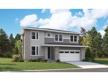 New construction home with a two-car garage, modern design and professionally landscaped front yard at 2681 Mondt Ln, Erie, CO 80026