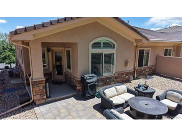 This outdoor patio boasts comfortable seating, a fire pit, and beautiful views at 6945 N Fargo Trl, Littleton, CO 80125