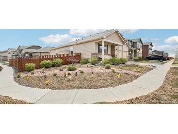 Charming single-Gathering home with a well-maintained yard, garden, and inviting curb appeal at 2122 Opal Ave, Brighton, CO 80603