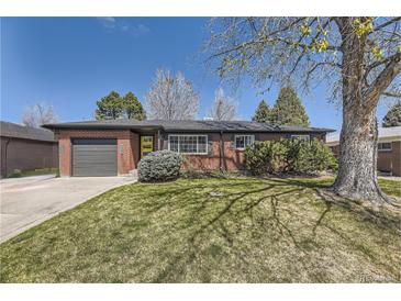 Charming brick home featuring mature landscaping and a well-manicured lawn at 5485 E Bails Dr, Denver, CO 80222