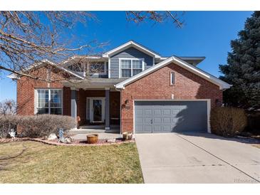 Charming two-story brick home with a well-maintained front yard and attached two-car garage at 3259 W 111Th Drive, Westminster, CO 80031