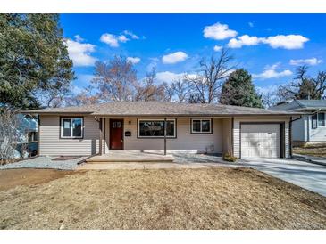 Charming single-story home featuring a well-maintained lawn, inviting entrance, and an attached one car garage at 3000 S Jackson St, Denver, CO 80210