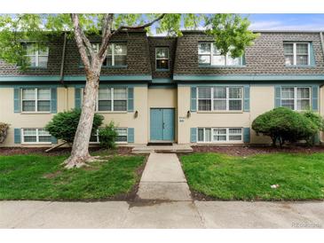 Inviting exterior with a well-manicured lawn, beautiful trees, and charming curb appeal at 9240 E Girard Ave # 1, Denver, CO 80231