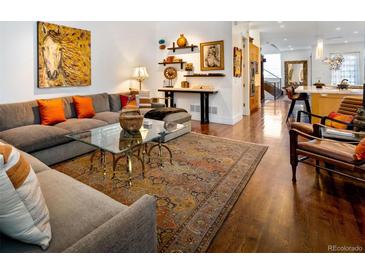 Comfortable living room with hardwood floors, modern furniture and stylish decor at 402 Garfield St, Denver, CO 80206