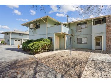 Two-story townhome featuring lush landscaping and a serene exterior at 1112 Elysian Field Dr # E, Lafayette, CO 80026
