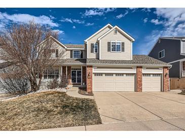 Charming two-story home featuring a three-car garage and well-maintained lawn at 3416 Hawthorne Dr, Highlands Ranch, CO 80126