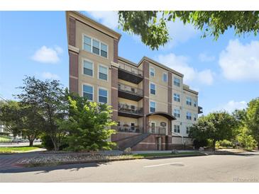 A charming apartment building with multiple balconies on a sunny day at 1780 N Washington St # 203, Denver, CO 80203