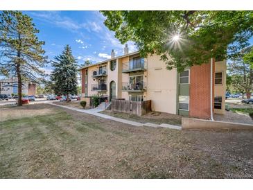 A charming two-story apartment building featuring multiple balconies and an inviting facade at 12113 Melody Dr # 304, Denver, CO 80234