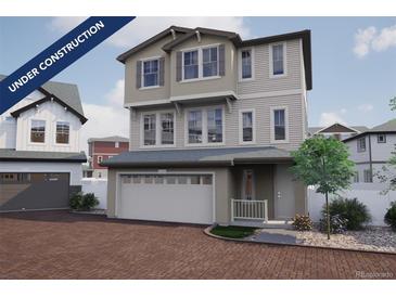 Charming new two-story home featuring an attached two-car garage and landscaped front yard at 1163 Highview Dr, Erie, CO 80516