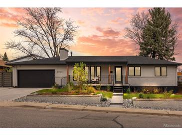 Charming single-story home featuring a landscaped front yard and an attached garage at 2905 Regis Dr, Boulder, CO 80305