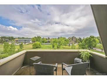 View from balcony showing a landscape with trees and a building in the distance at 3240 Iris Ave # G409, Boulder, CO 80301