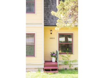 Charming front entrance with the house number displayed above and a flower pot next to the door at 105 S High St # A, Breckenridge, CO 80424