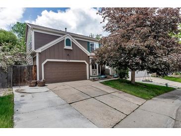 Charming two-story home with a two-car garage and well-maintained landscaping at 573 Entrada Dr, Golden, CO 80401
