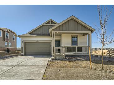 Charming single-Gathering home with a two-car garage and covered porch, perfect for enjoying the outdoors at 16552 E 109Th Ave, Commerce City, CO 80022