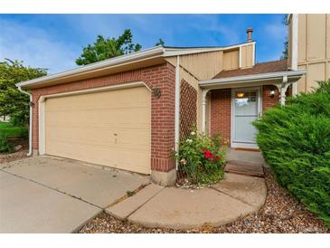 Charming brick home with attached garage and well-maintained landscaping at 11532 Newland St, Westminster, CO 80020