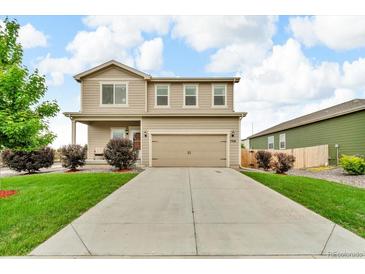 Charming two-story home with landscaped front yard, long driveway, and attached two-car garage at 7218 Animas Ave, Frederick, CO 80530