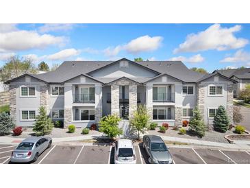 Attractive two-story condo with private balconies and stone accents at 875 E 78Th Ave # 52, Denver, CO 80229