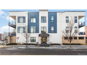 Inviting Logan Lofts features modern blue and white facade with ample windows and outdoor living at 336 E 1St Ave # 209, Denver, CO 80203