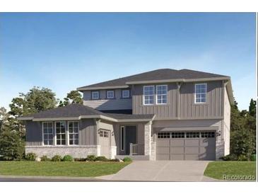 Charming two-story home with a two-car garage, neutral paint, and well-maintained landscaping at 1167 Morning Side Dr, Erie, CO 80516