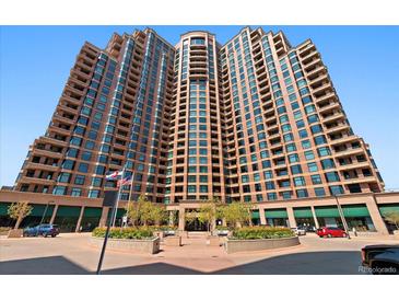 Stunning exterior of a tall luxury apartment building with beautifully landscaped entrance and prominent location at 8100 E Union Ave # 1603, Denver, CO 80237