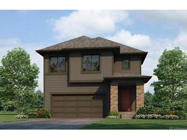 Modern two-story home featuring a two-car garage, stone accents, and a well-manicured lawn at 17847 Dandy Brush Dr, Parker, CO 80134